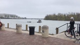 A boat does doughnuts on the Potomac River after hitting a wave and tossing its driver.