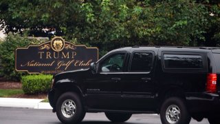 The motorcade carrying US President Donald Trump enters the Trump National Golf Club in Sterling, Virginia, on September 8, 2018