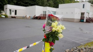 Flowers and police cordon are pictured in front of the Al-Noor Islamic Centre Mosque in Baerum near Oslo, Norway on August 12, 2019.