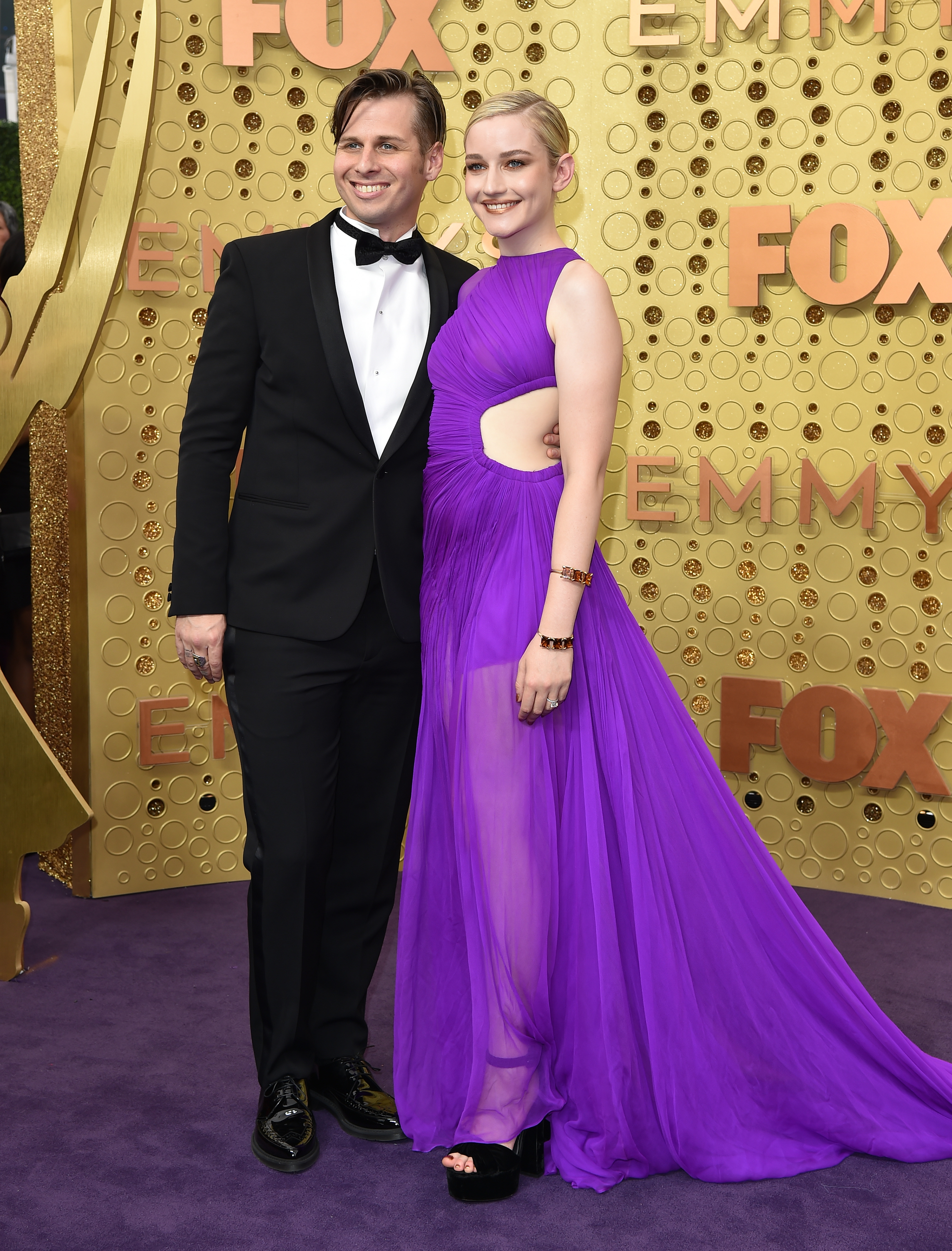 In this Sept. 22, 2019, file photo, Mark Foster and Julia Garner attend the 71st Emmy Awards at Microsoft Theater in Los Angeles.