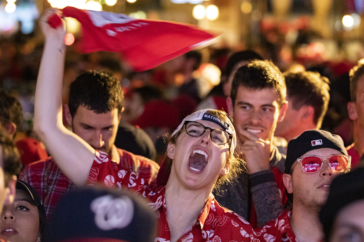 Fans react to the World Series Game 7 on a big screen just a block from Nationals Park at Walter's Sports Bar on October 30, 2019 in Washington, D.C. (Photo by Samuel Corum/Getty Images)