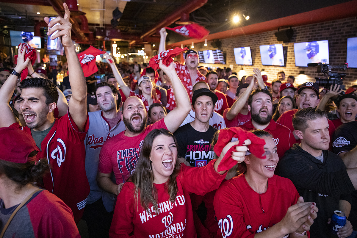 Fans react to the World Series Game 7 on a big screen just a block from Nationals Park at Walter's Sports Bar on October 30, 2019 in Washington, D.C. (Photo by Samuel Corum/Getty Images)