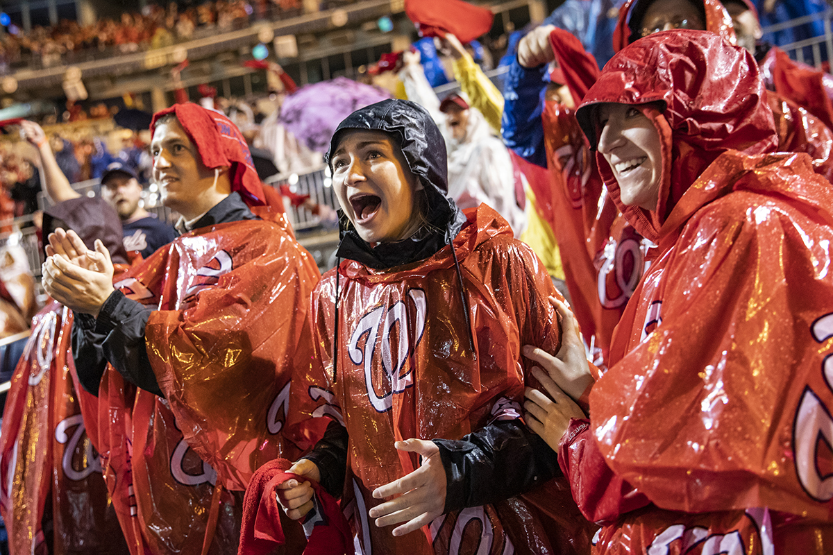 Nationals fans react to the home run that gave the Washington Nationals the lead in Game 7 of the World Series at an official watch party at Nationals Park. (Photo by Samuel Corum/Getty Images)