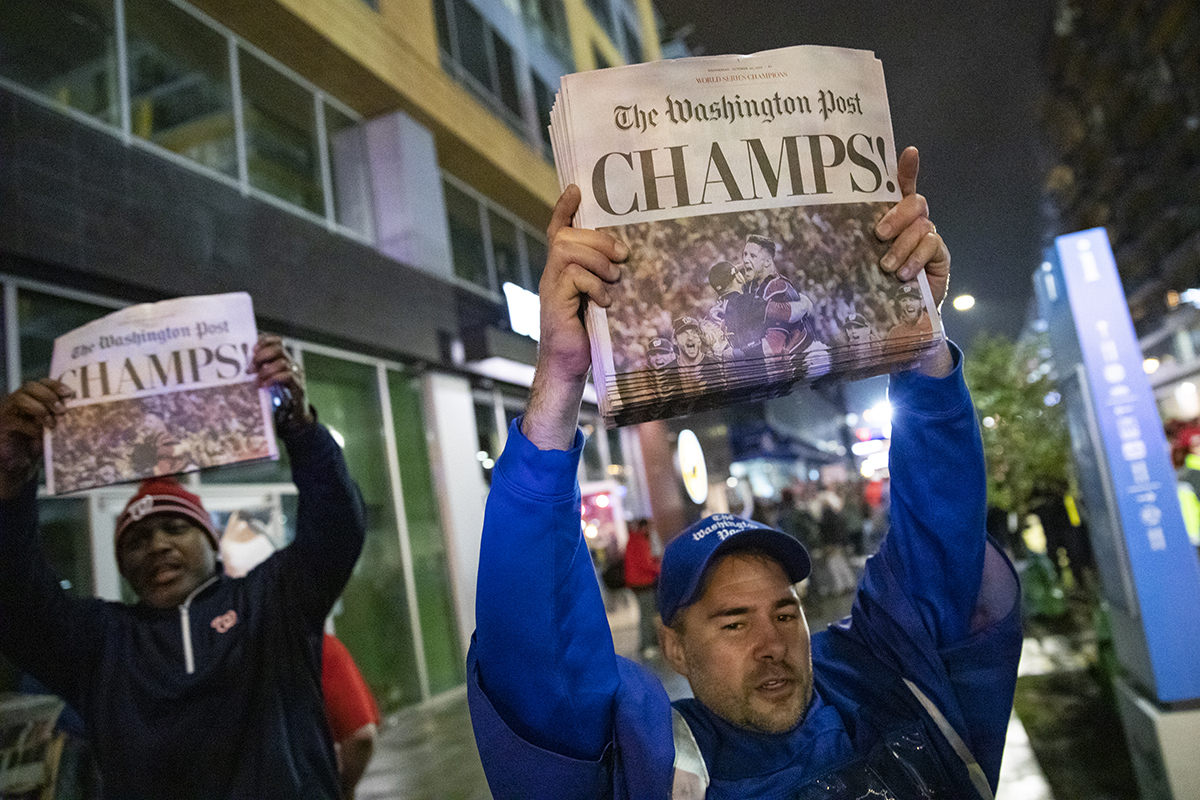 Copies of the Washington Post declare the Washington Nationals champions, outside of Nats Park on Oct. 30, 2019. (Photo by Samuel Corum/Getty Images)