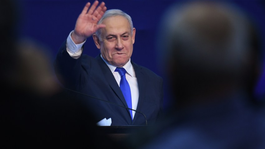 Israeli Prime Minister Benjamin Netanyahu gestures as he speaks to supporters