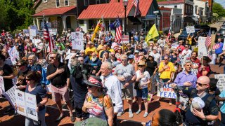 Members of the Reopen Maryland group protest the stay at home orders by Maryland Govenor Larry Hogan around the State House on Friday Afternoon.