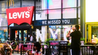 NEW YORK, NEW YORK - JULY 01: 'We missed you NYC' sign is seen outside the Levi's store in Times Square as New York City moves into Phase 2 of re-opening following restrictions imposed to curb the coronavirus pandemic on July 1, 2020. Phase 2 permits the reopening of offices, in-store retail, outdoor dining, barbers and beauty parlors and numerous other businesses. Phase 2 is the second of four phased stages designated by the state.