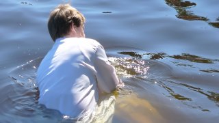 Pastor baptizing a person