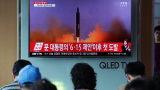 In this July 4, 2017, file photo, people watch a television broadcast reporting a North Korean missile launch at the Seoul Railway Station in Seoul, South Korea.