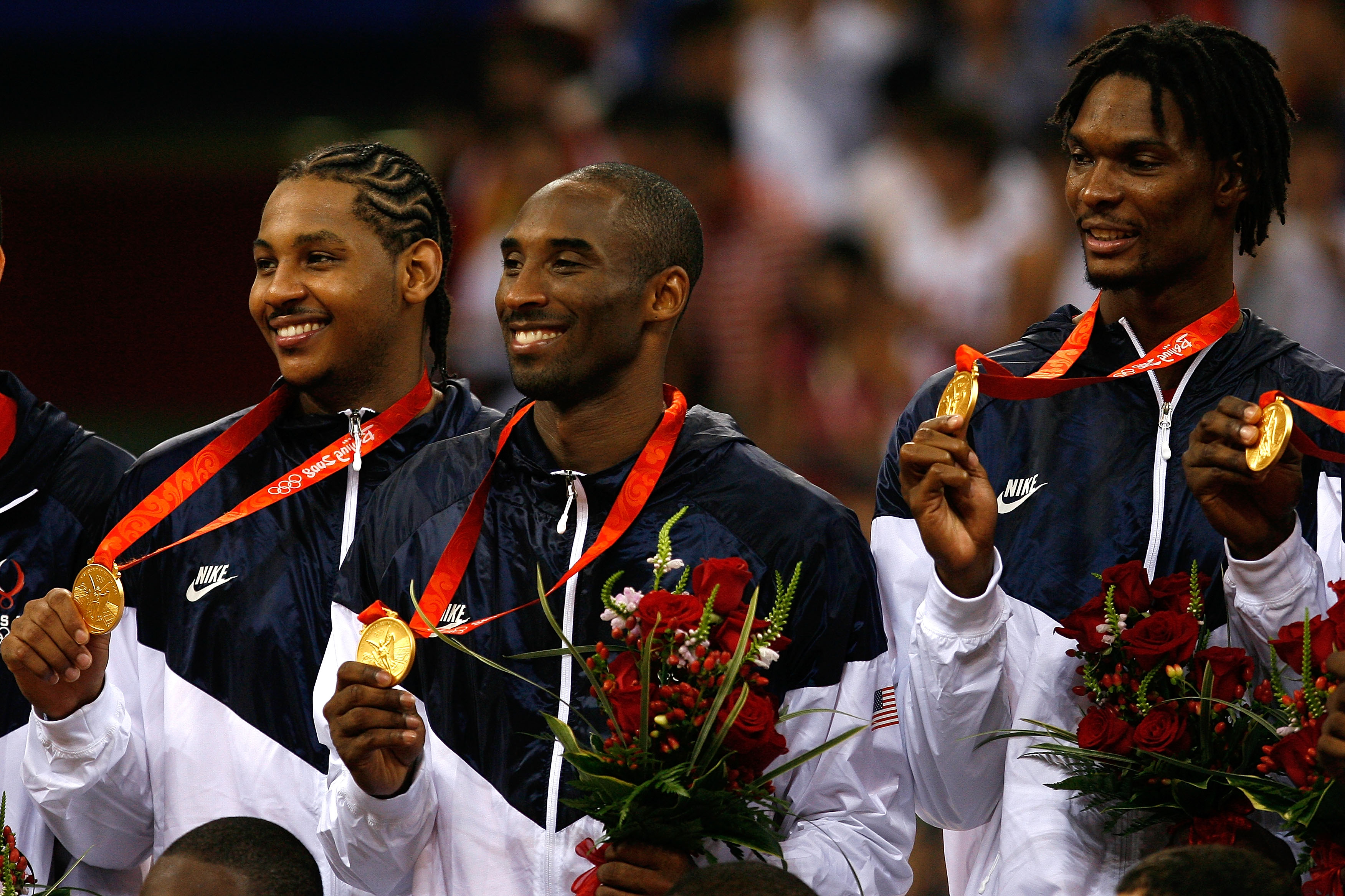 (L-R) Carmelo Anthony, Kobe Bryant and Chris Bosh of the United States hold their gold medals after defeating Spain 118-107 in the gold medal game during Day 16 of the Beijing 2008 Olympic Games at the Beijing Olympic Basketball Gymnasium on Aug. 24, 2008 in Beijing, China.