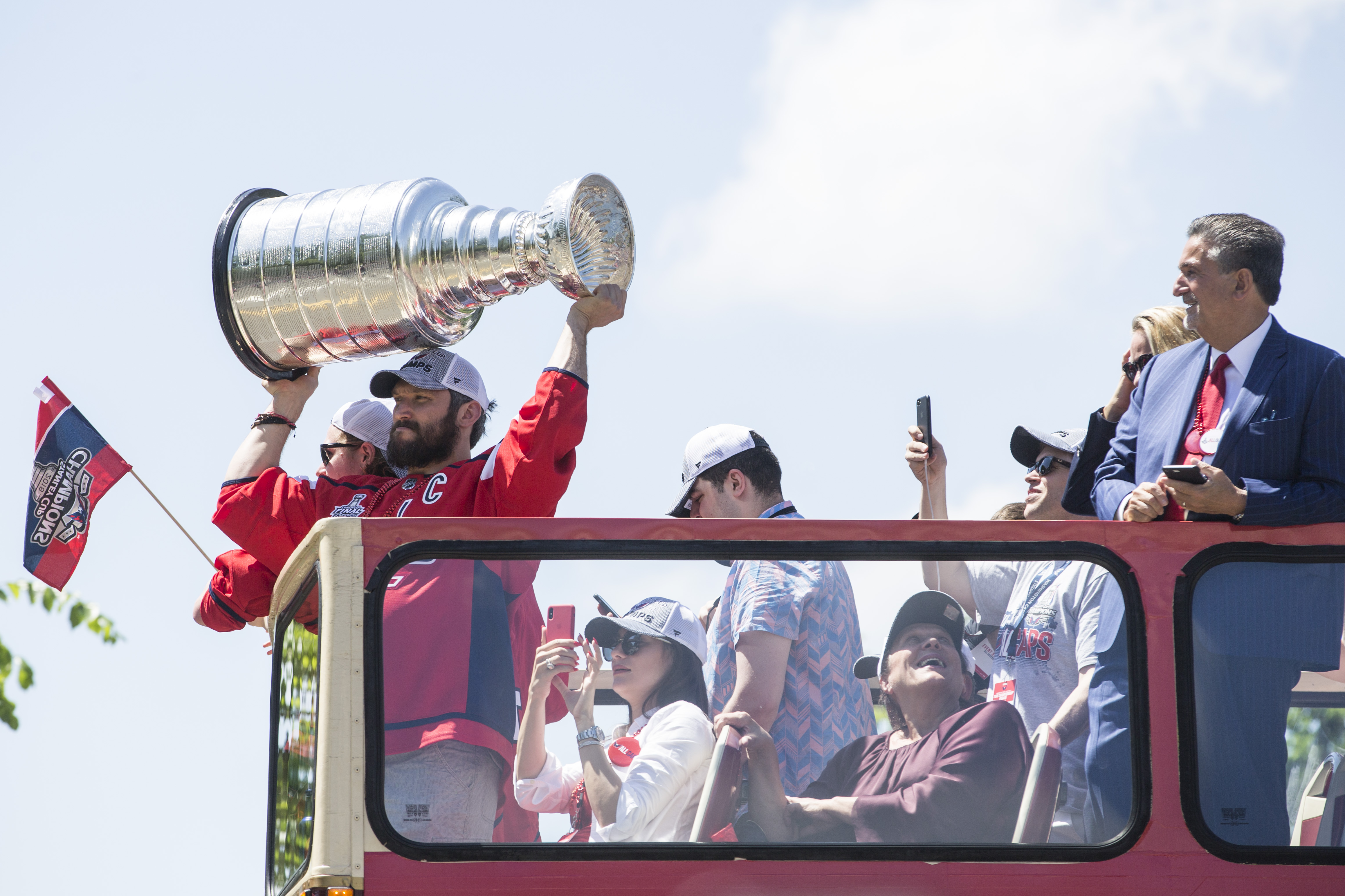 Washington Capitals' T.J. Oshie chugs a beer through his jersey at Stanley  Cup rally 