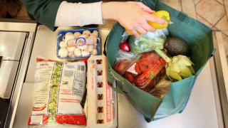 Woman bagging groceries