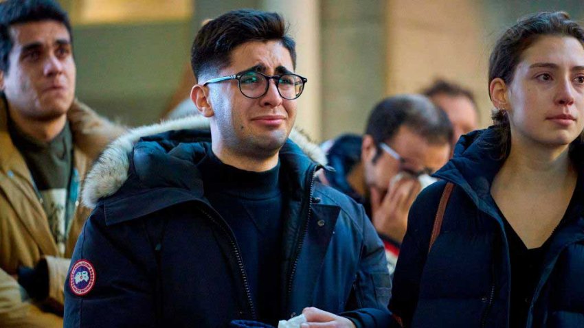 A man weeps during a service at Western University in London, Ontario on January 8, 2020 for the four graduate students who were killed in a plane crash in Iran. – A Ukrainian airliner crashed shortly after take-off from Tehran on January 8 killing all 176 people on board, in a disaster striking a region rattled by heightened military tensions.