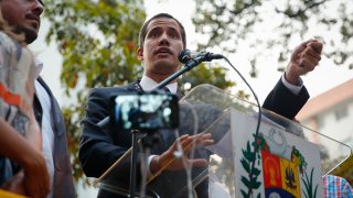 Venezuela's Juan Guaido speaks from a lectern