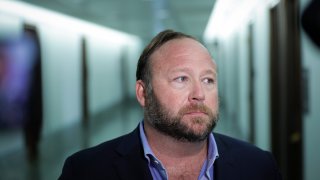 Alex Jones talks to reporters after Senate hearing