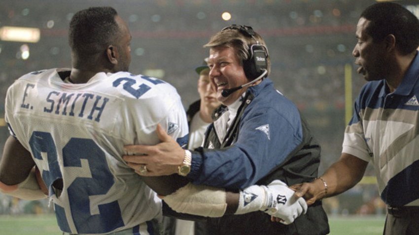 Head Coach Jimmy Johnson and Emmitt Smith #22 of the Dallas Cowboys celebrates as the Cowboys leads the Buffalo Bills late in the fourth quarter of Super Bowl XXVIII on Jan. 30, 1994 at the Georgia Dome in Atlanta, Georgia. The Cowboys won the Super Bowl 30 -13.