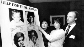 In this April 19, 1985, file photo, Jennifer Matthews, 16, points to a photo of her missing sister, Jonelle, 13, as parents Gloria and Jim Matthews, of Boulder, Colorado, in New York.