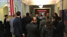 Members of DC real estate community gather outside Council chambers to celebrate Topa vote