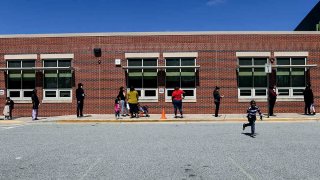 Parents wait in line during Montgomery County Chromebook distribution