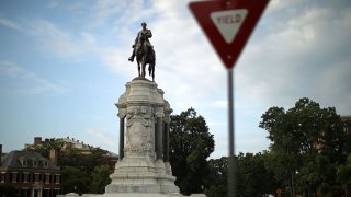 The statue of Confederate Gen. Robert E. Lee, unveiled in 1890, stands at the center of Lee Circle along Monument Avenue in Richmond, Virginia.