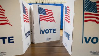 Privacy screens sit on a table at a polling place in Armstrong Elementary School for the Democratic presidential primary election on Super Tuesday, March 3, 2020, in Herndon, Virginia.