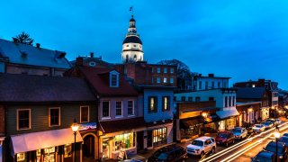 Maryland State Capitol is seen at dusk above Main Street Annapolis, Maryland.