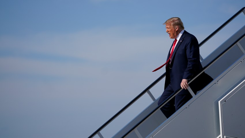 President Donald Trump exits Air Force One as he arrives at Tulsa International Airport on Saturday, June 20, 2020, in Tulsa, Okla.