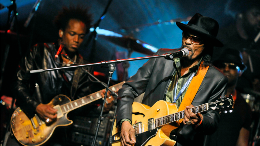 chuck brown performs on stage