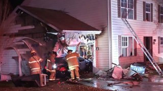 A driver crashed into a Maryland home early Tuesday morning, causing the car to burst into flames.
