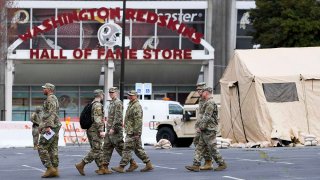 The Maryland National Guard set up tents and generators in preparation for a coronavirus testing site at the FedEx Field parking lot in Landover, Md