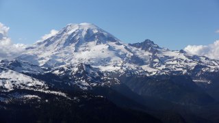 In this file photo taken June 19, 2013, Mount Rainier is seen from a helicopter flying south of the mountain and west of Yakima, Washington.