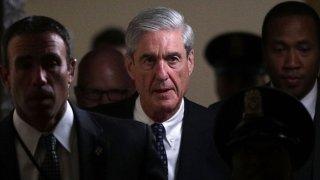 In this June 21, 2017, file photo, special counsel Robert Mueller (2nd L) leaves after a closed meeting with members of the Senate Judiciary Committee at the Capitol in Washington, DC.