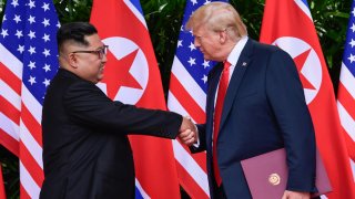 In this June 12, 2018, file photo, North Korea leader Kim Jong Un, left, and U.S. President Donald Trump shake hands at the conclusion of their meetings at the Capella resort on Sentosa Island in Singapore.