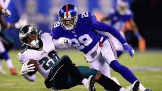 Miles Sanders of the Philadelphia Eagles is tackled by Deone Bucannon of the New York Giants at MetLife Stadium on Dec. 29, 2019, in East Rutherford, New Jersey.
