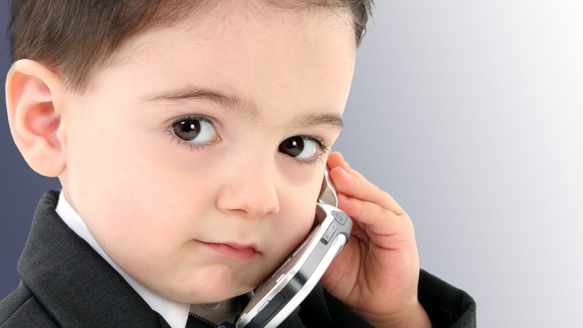 Adorable Baby Boy in Suit on Cellphone