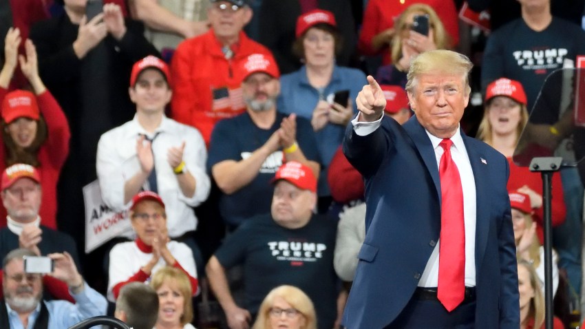 In this Dec. 10, 2019, file photo, U.S. President Donald Trump greets supporters as he steps on the stage for a campaign rally with Vice President Mike Pence at the Giant Center, in Hershey, PA.