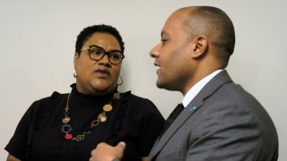 Del. Marcia Price, D-Newport News, left, and Garrett Arwa, Director of Capaigns for the National Democratic Redistricting Committee, right, confer before a press conference dealing with Price’s HB1256, a redestricting bill, inside the Pocahontas Building in Richmond, Va., Tuesday, Jan. 14, 2020.