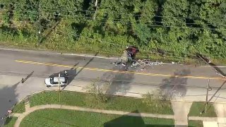 Two people were killed when their SUV crashed into utility poles.
