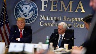 WASHINGTON, DC - MARCH 19: President Donald Trump (L) and Vice President Mike Pence attend a teleconference with governors at the Federal Emergency Management Agency headquarters on March 19, 2020 in Washington, DC. With Americans testing positive from coronavirus rising President Trump is asking Congress for $1 trillion aid package to deal with the COVID-19 pandemic.