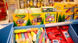 In this file photo, Crayola LLC crayons and other school supplies sit for sale in the back to school section inside a Target Corp. store in Torrance, California, U.S., on Tuesday, August 20, 2013.