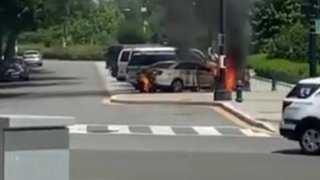 A Supreme Court police car on fire.