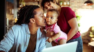 Family working from home with a baby