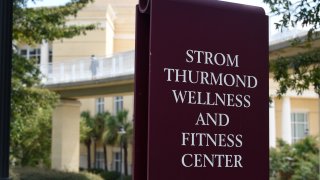 A sign advertises the Strom Thurmond Wellness and Fitness Center on Thursday, Aug. 20, 2020, in Columbia, S.C. Some of the University of South Carolina's most prominent recent athletes are calling for the renaming of the $38.6 million complex, arguing that its namesake shouldn't be glorified for his segregationist views.