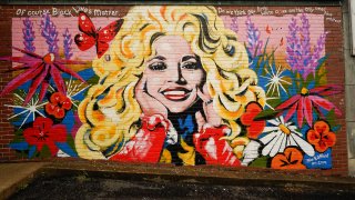 A mural of Dolly Parton is seen outside The 5 Spot, a music club in Nashville, Tenn., Friday, Aug. 21, 2020