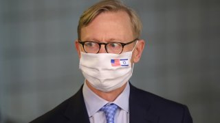 US special representative for Iran Brian Hook wears a face mask against Covid-19, bearing the US and Israeli flags, during a meeting with the Israeli prime minister in Jerusalem on June 30, 2020.