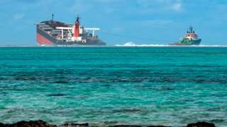 A picture taken on August 15, 2020 near Blue Bay Marine Park, shows the vessel MV Wakashio, belonging to a Japanese company but Panamanian-flagged, that ran aground near Blue Bay Marine Park off the coast of south-east Mauritius