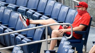 Stephen Strasburg of the Washington Nationals watching a game against the Toronto Blue Jays from the stands at Nationals Park on July 28.