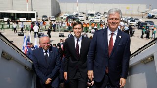 Israeli National Security Advisor Meir Ben-Shabbat, left, U.S. President Donald Trump's senior adviser Jared Kushner, center, and U.S. National Security Advisor Robert O'Brien, right, board the Israeli flag carrier El Al's airliner as they fly to Abu Dhabi for talks meant to put final touches on the normalization deal between the United Arab Emirates and Israel, at Ben-Gurion International Airport, near Tel Aviv, Israel Monday, Aug. 31, 2020.