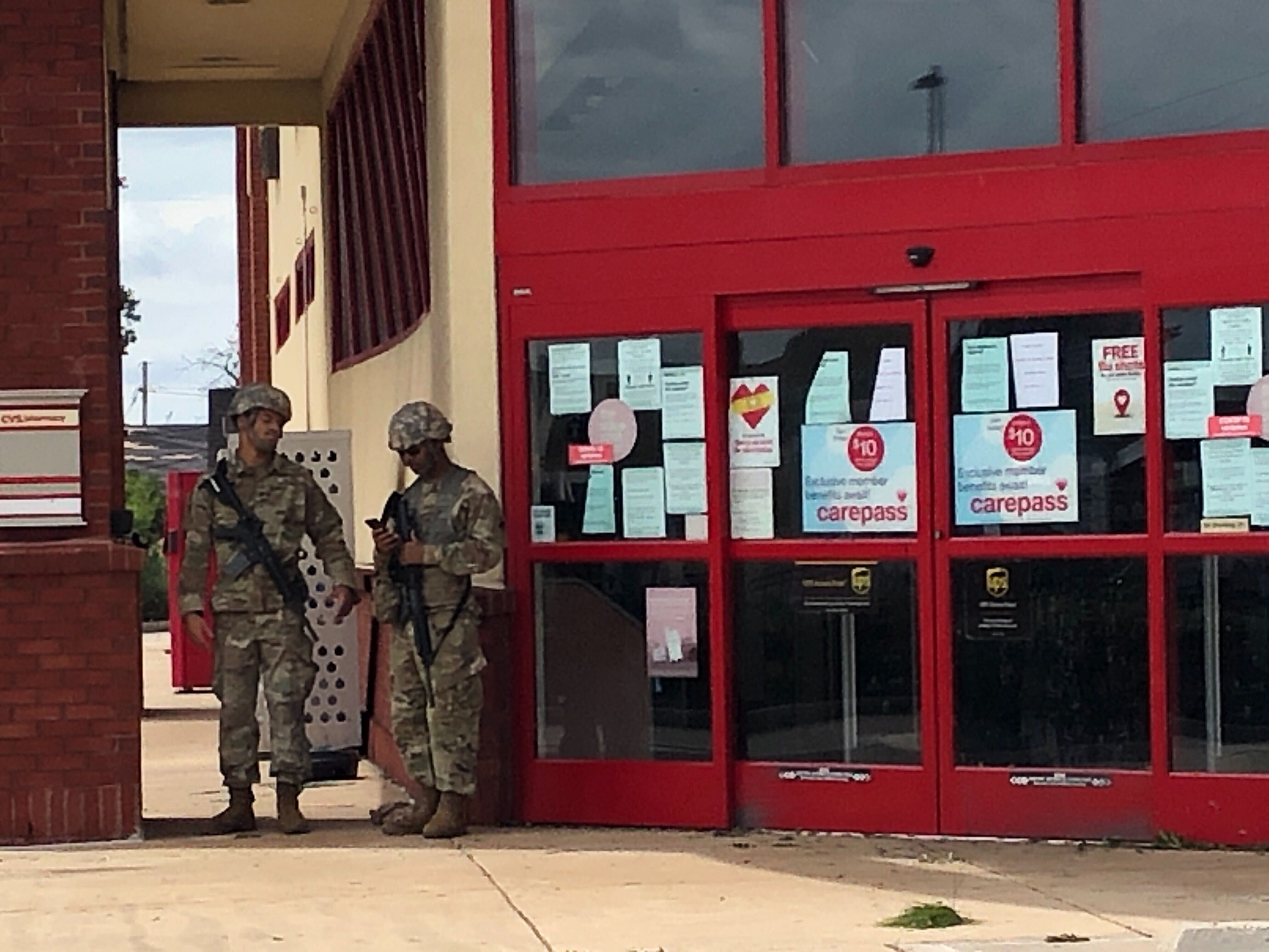 Lake Charles damage. Army National Guard guarding a CVS.