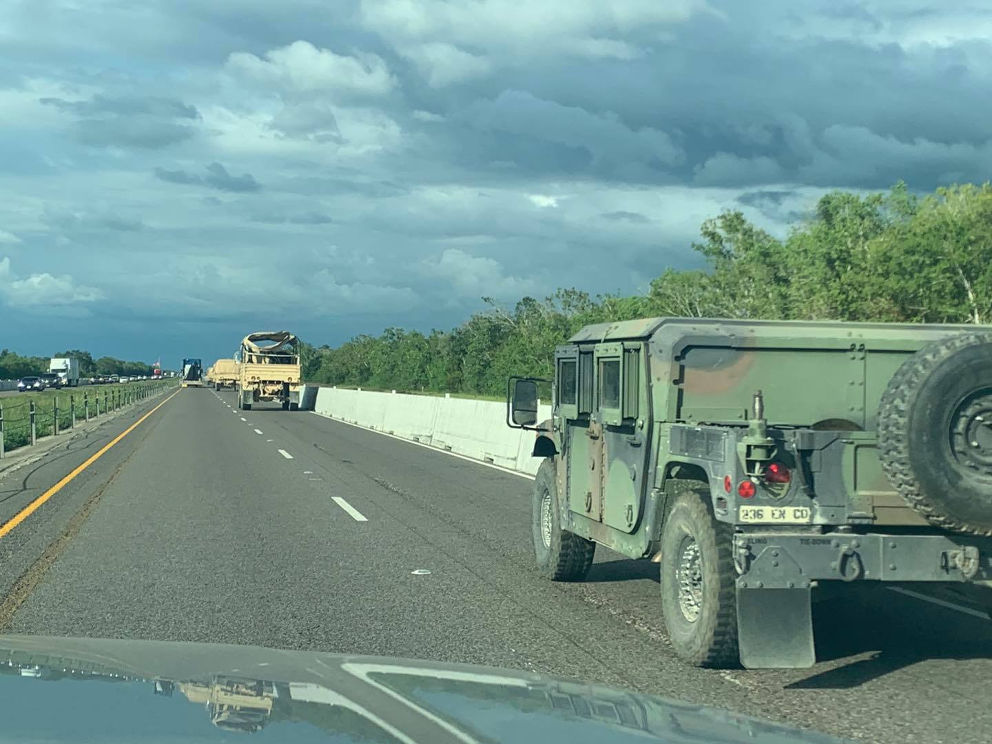 Convoy of high-water National Guard trucks on I-10 a few miles outside of Beaumont.